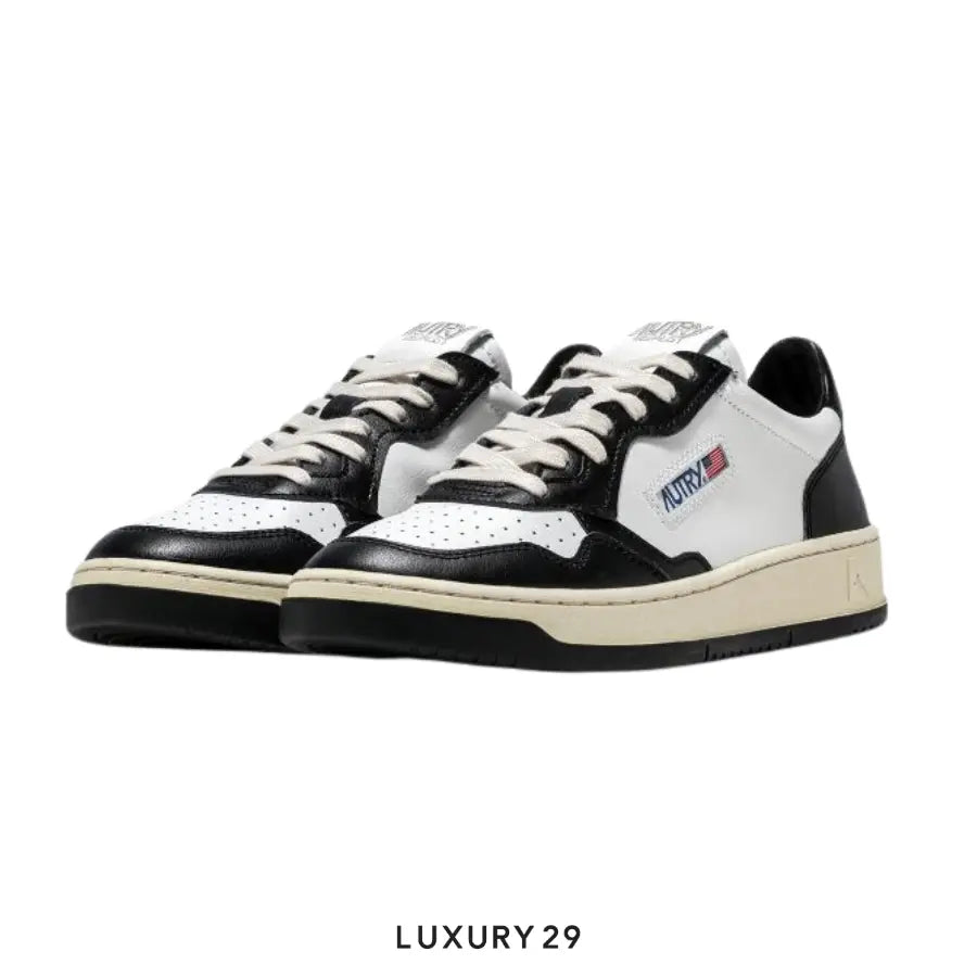 AUTRY SNEAKERS WOMAN MEDALIST LOW SNEAKERS IN TWO-TONE LEATHER COLOR WHITE AND BLACK(M) AUTRY