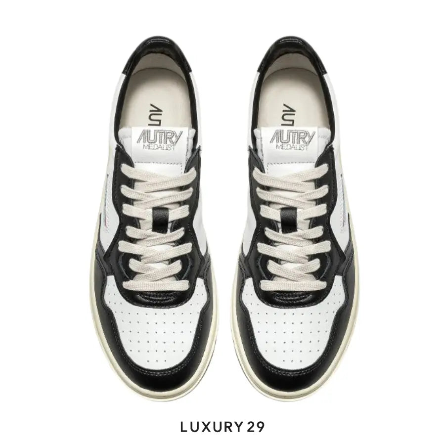 AUTRY SNEAKERS WOMAN MEDALIST LOW SNEAKERS IN TWO-TONE LEATHER COLOR WHITE AND BLACK(M) AUTRY