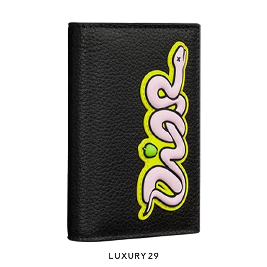 Black leather wallet with a pink snake design on a white background