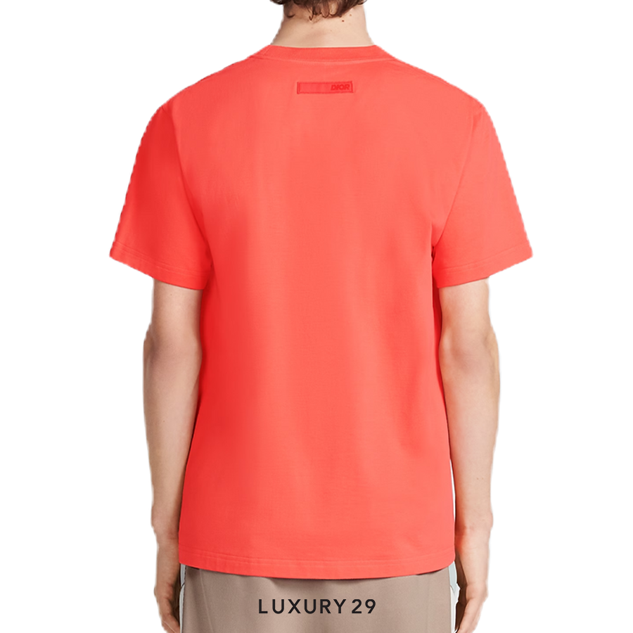 Red t-shirt worn by a person on a white background