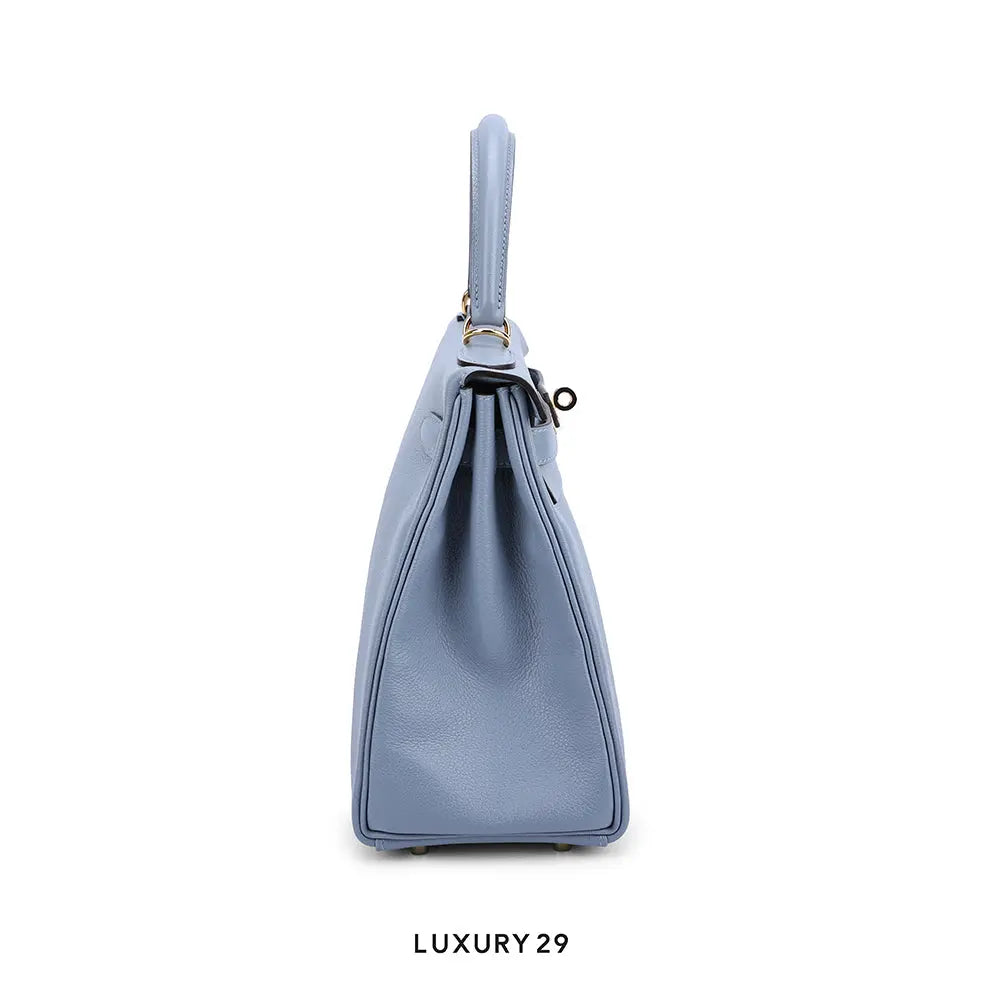 Blue handbag on a white background with 'LUXURY 29' branding.