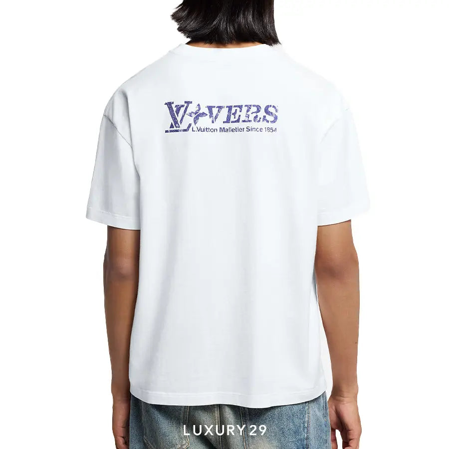 Person wearing a white t-shirt with a logo on the back, standing against a white background.