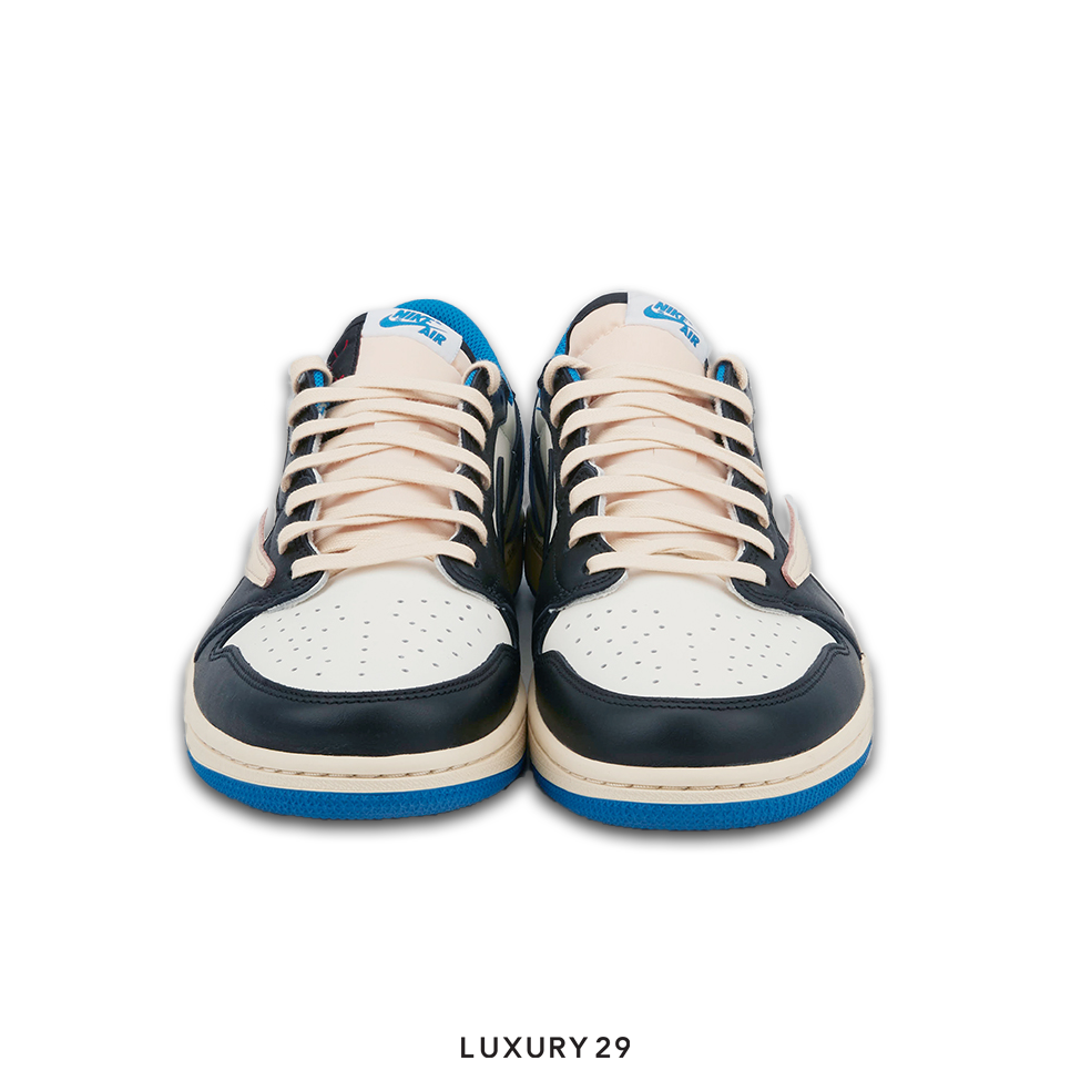 Pair of navy and white sneakers with blue accents on a white background