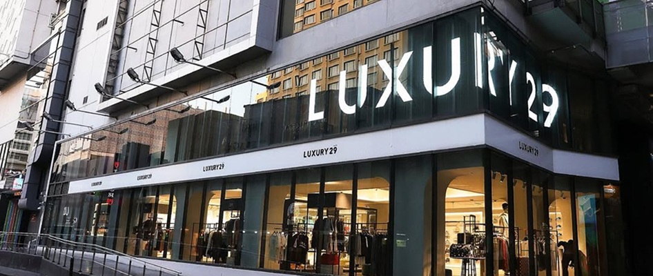 Luxury store with 'LUXURY29' sign on a city street