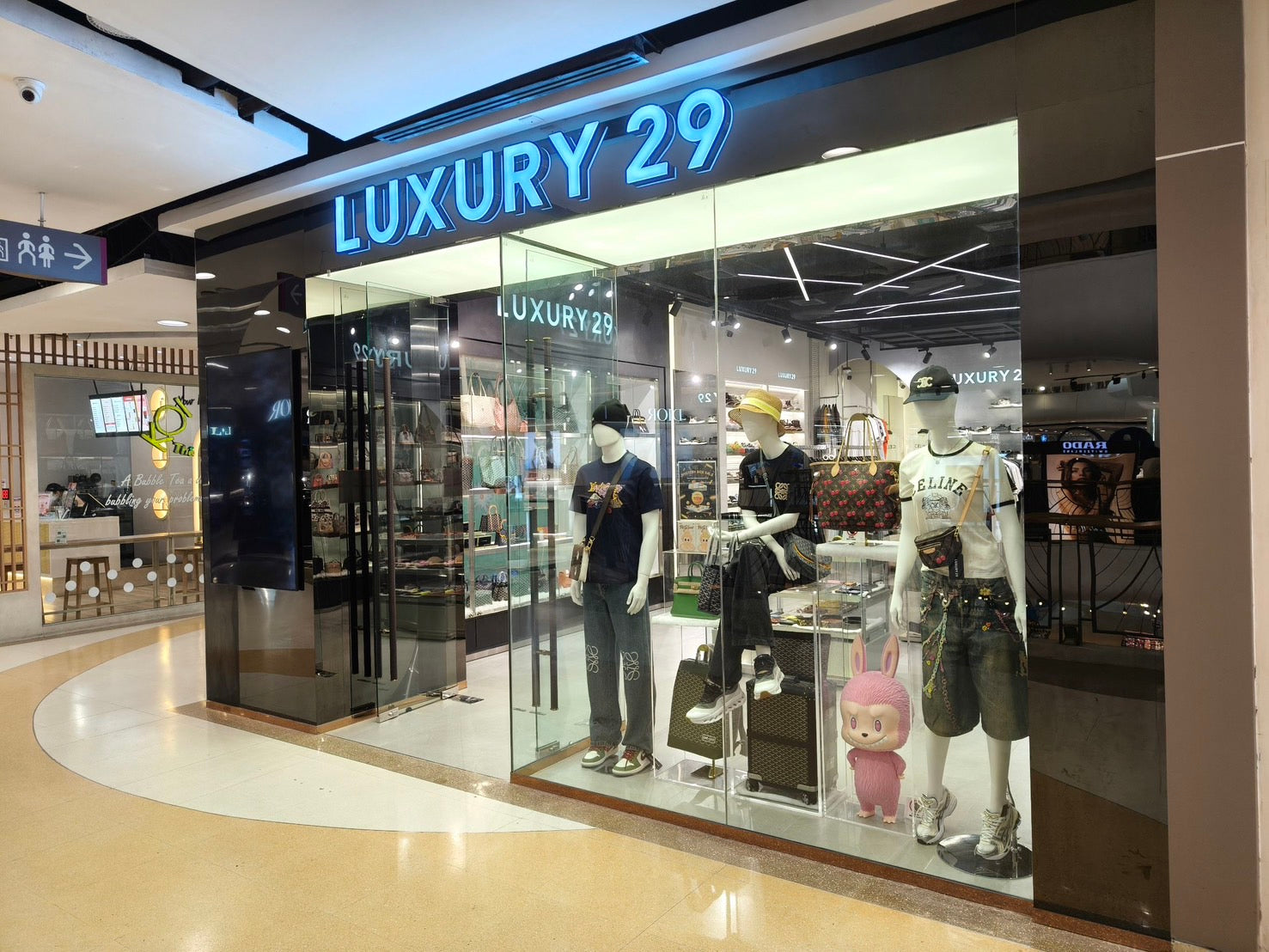 Luxury 29 store front with mannequins and products inside a mall.