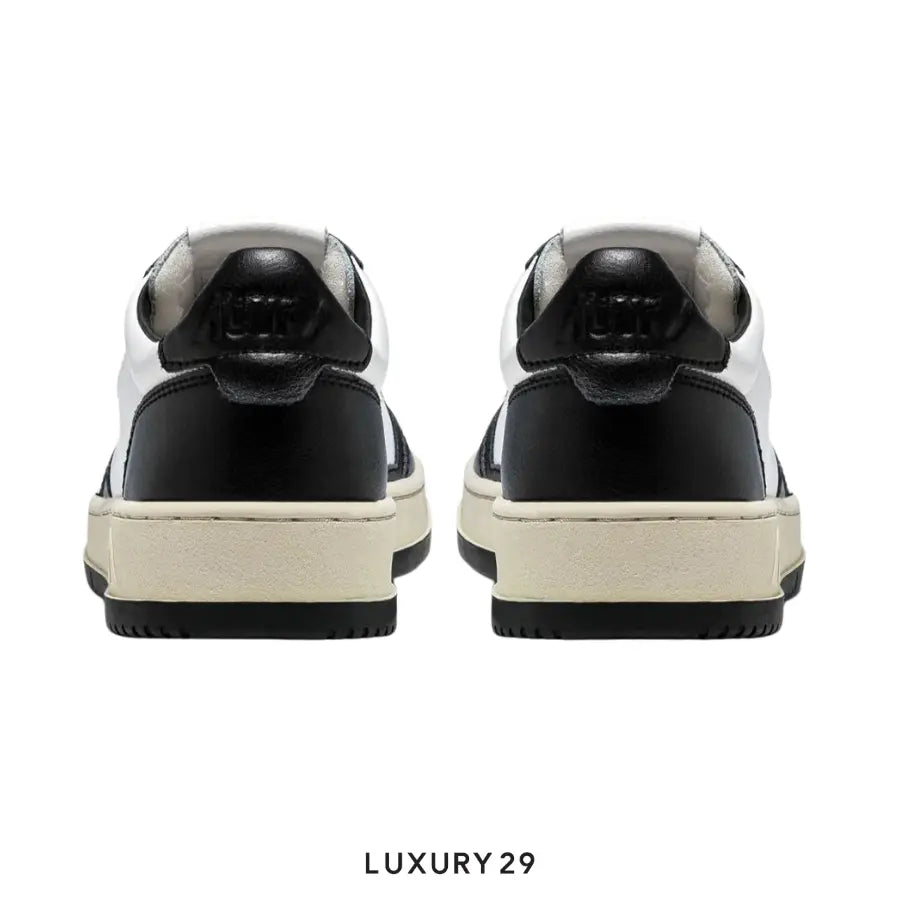 AUTRY SNEAKERS WOMAN MEDALIST LOW SNEAKERS IN TWO-TONE LEATHER COLOR WHITE AND BLACK(M) AUTRY
