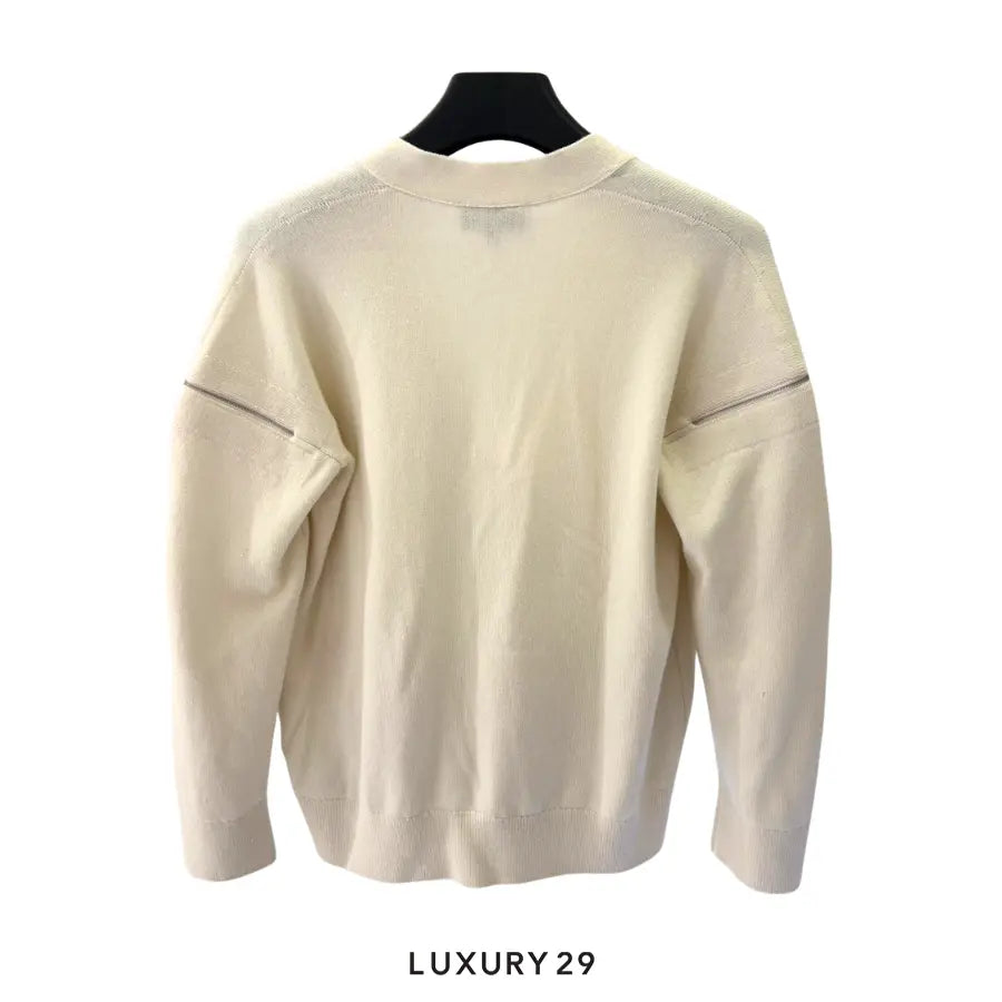 Chanel white knit cardigan V-neck front pockets with snap button closures and zipper accents on the shoulders/sleeves