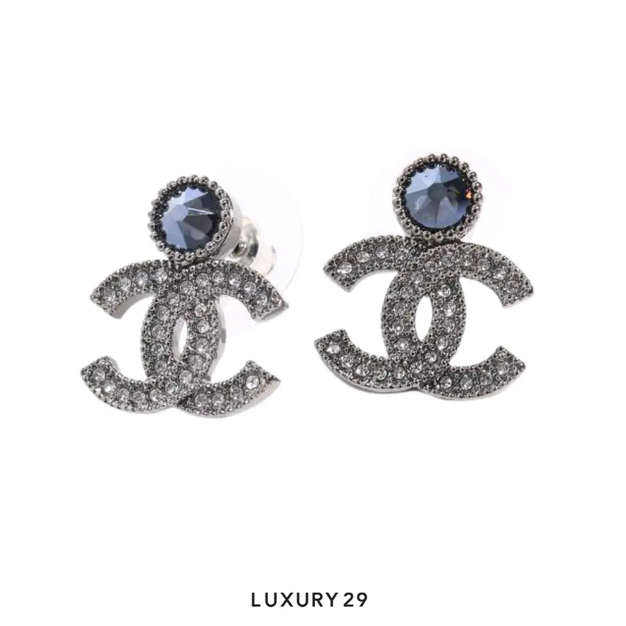 Chanel Coco Mark Stud Earrings CC logo adorned with clear crystals and a prominent dark