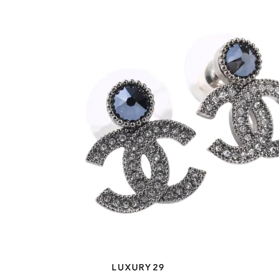 Chanel Coco Mark Stud Earrings CC logo adorned with clear crystals and a prominent dark