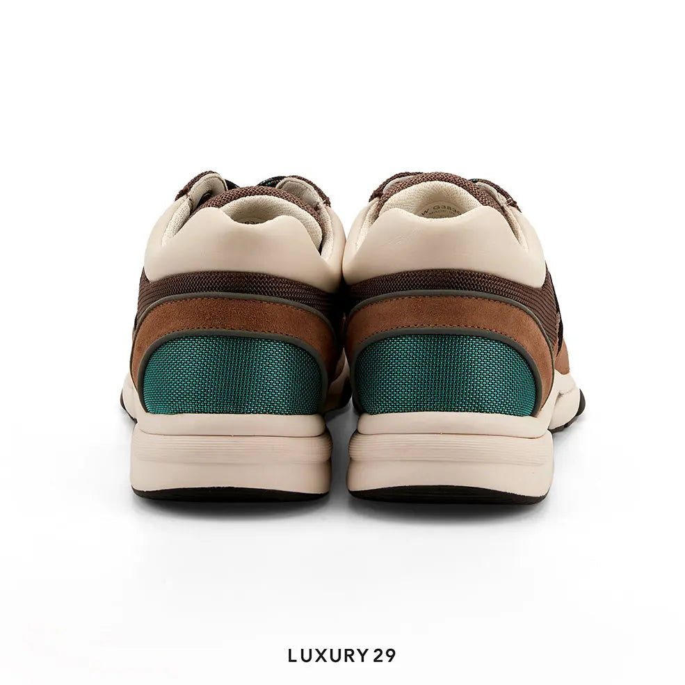 Pair of brown and beige sneakers with green accents on a white background, labeled 'LUXURY 29'.