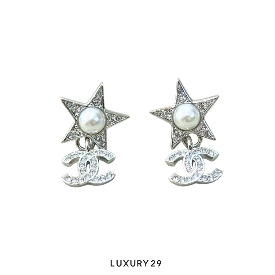 Chanel star drop earrings CC motif and a faux pearl star