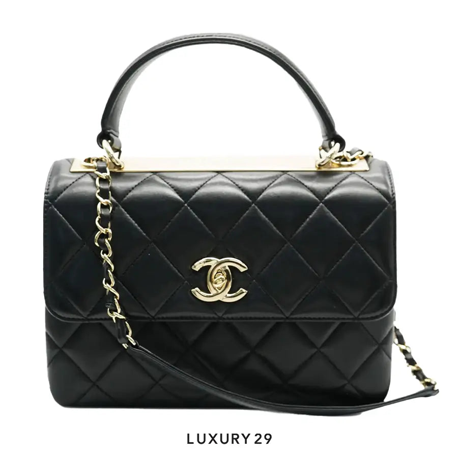 Chanel Flap Bag with Top Handle
Lambskin & Gold-Tone Metal
Black