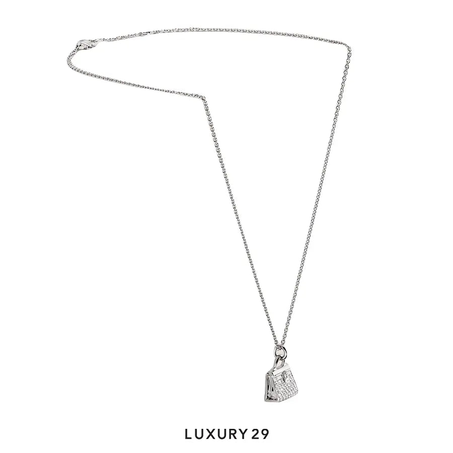 Hermes Amulettes Kelly pendant White gold HERMES