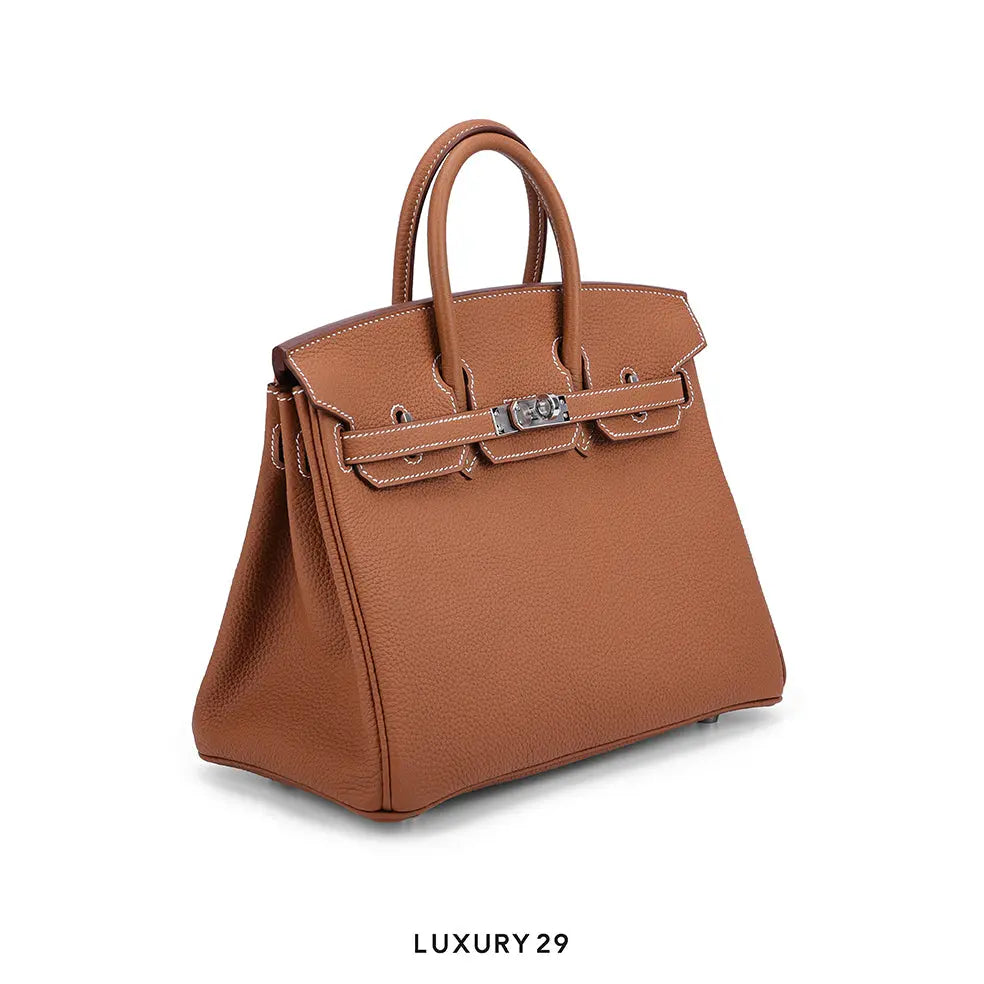 Brown handbag with visible brand name on a white background