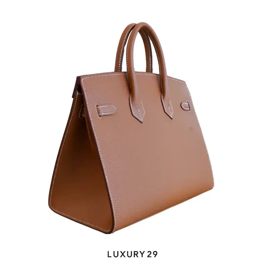 Brown leather handbag on a white background