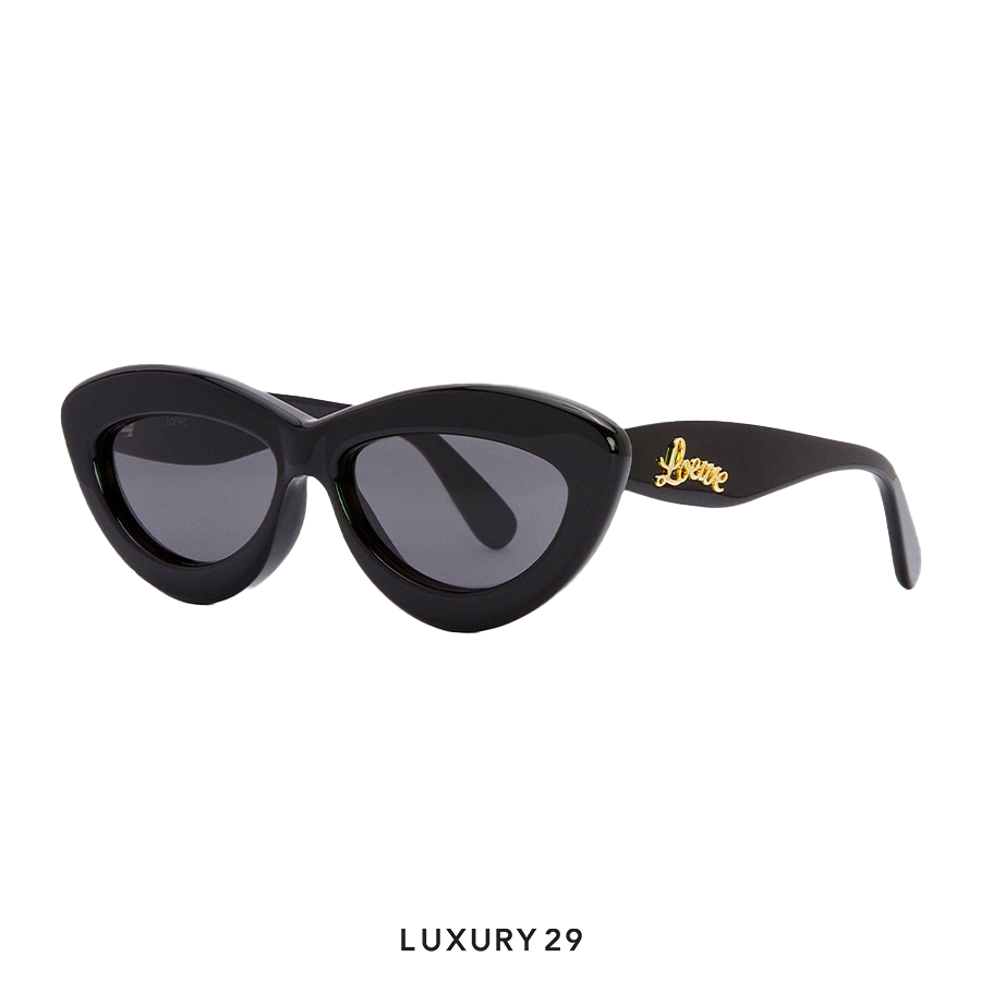 Black cat-eye sunglasses with a brand logo on a white background