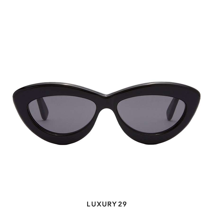 Black cat-eye sunglasses with dark lenses on a white background