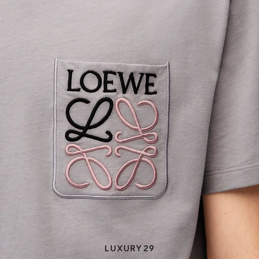 Gray t-shirt with Loewe logo and 'Luxury 29' text on a plain background
