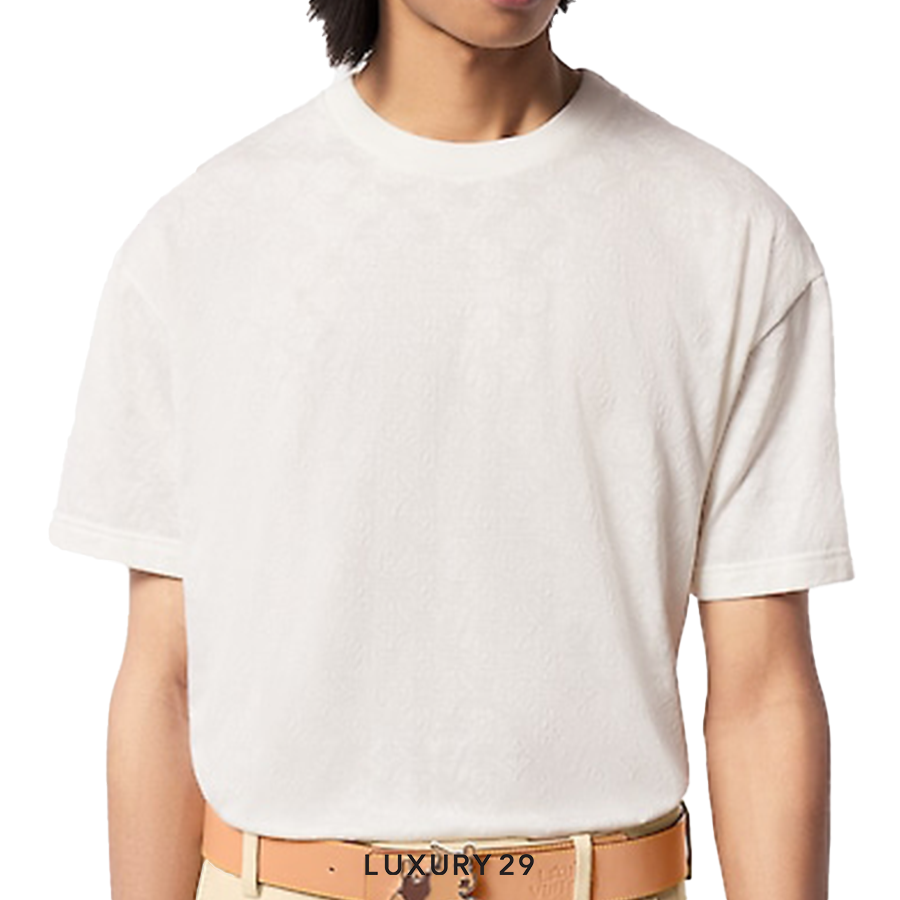 Person wearing a plain white t-shirt with a visible brand logo on a white background