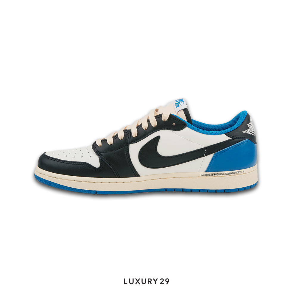 Black and white sneaker with blue accents on a white background