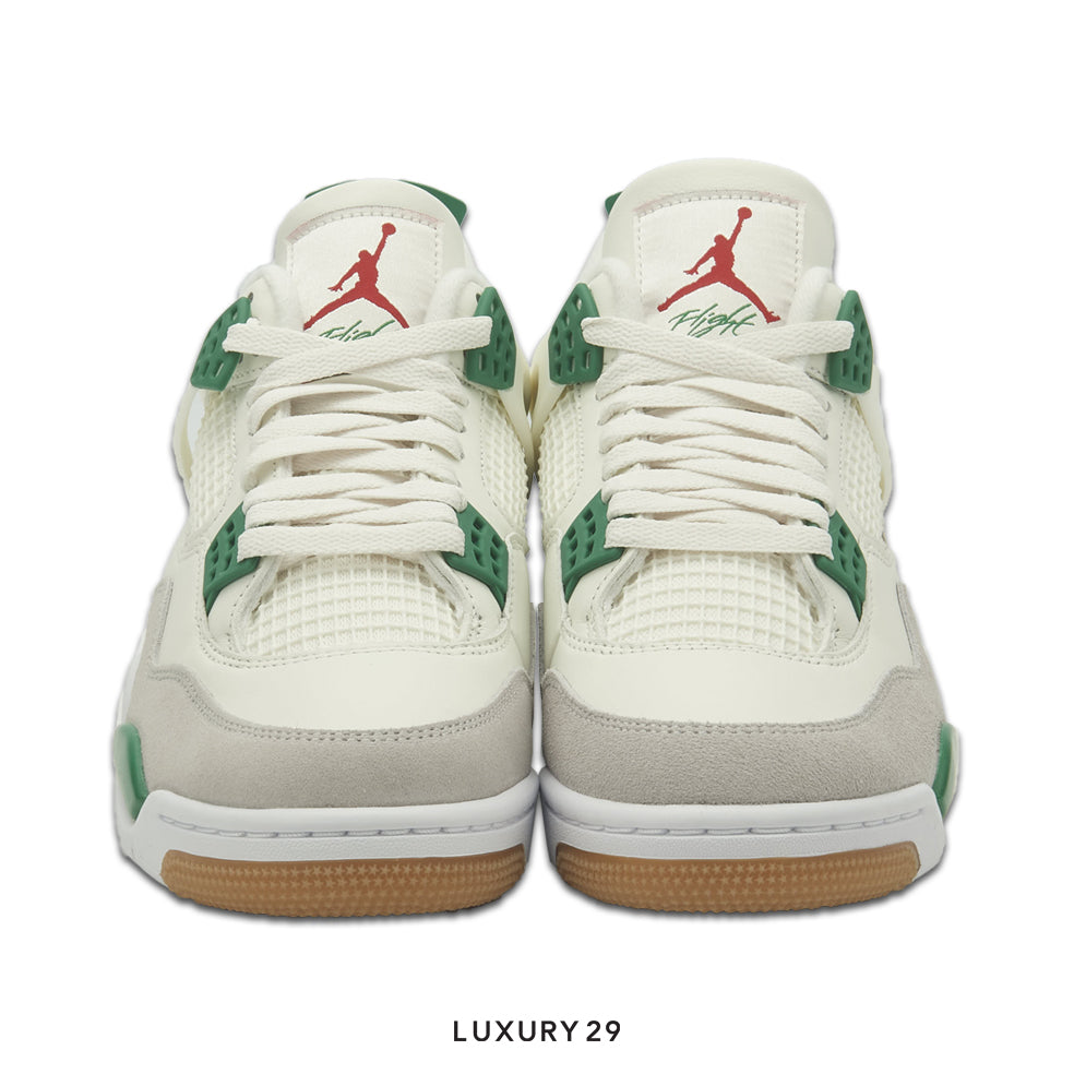White sneakers with green accents and red logo on a white background