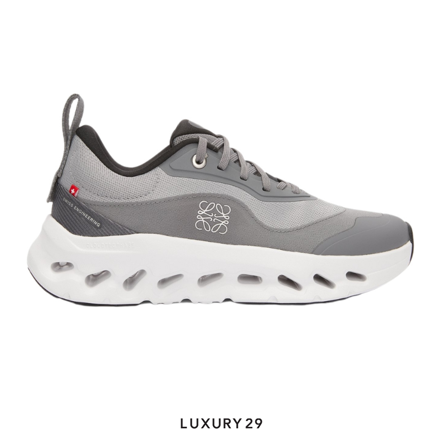 Gray sneaker with white sole on a white background