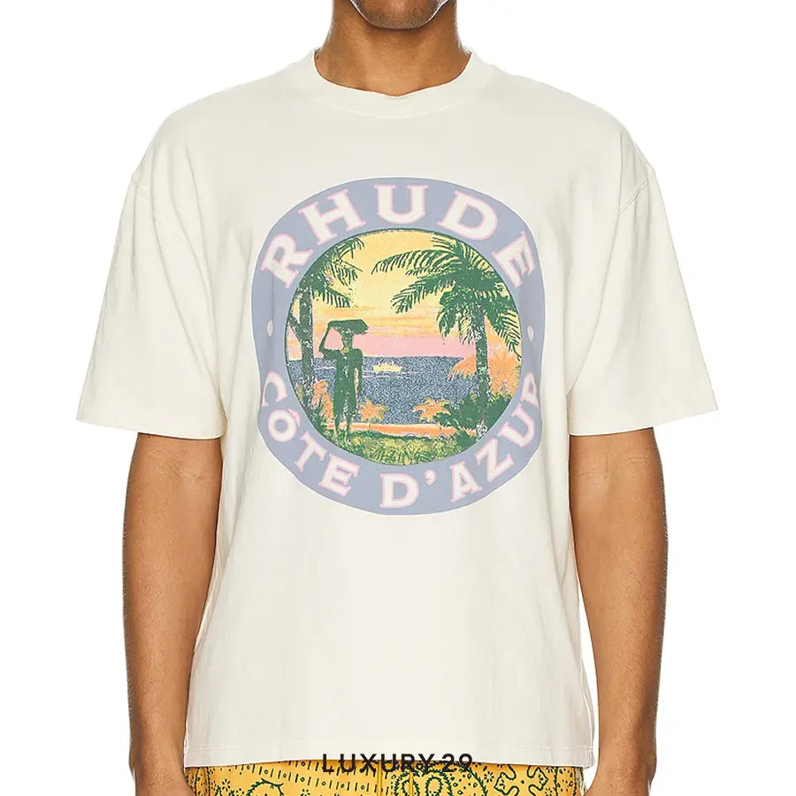 White t-shirt with a colorful graphic and 'RHUDE' branding on a white background