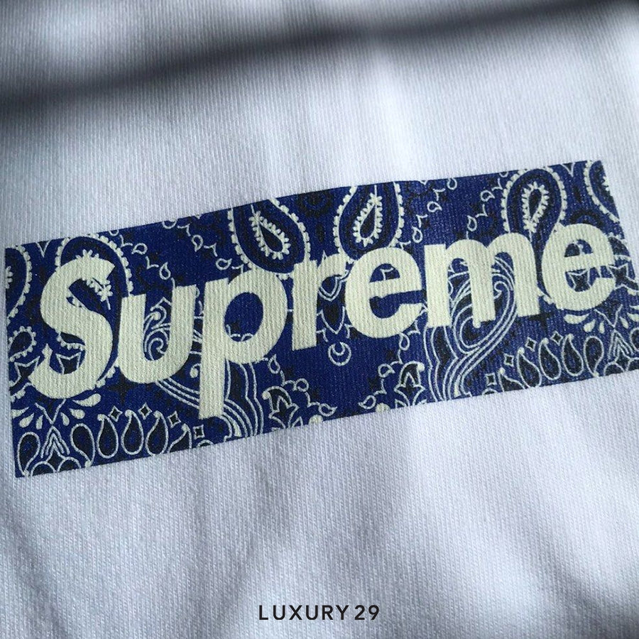 Supreme logo with bandana pattern on a gray background