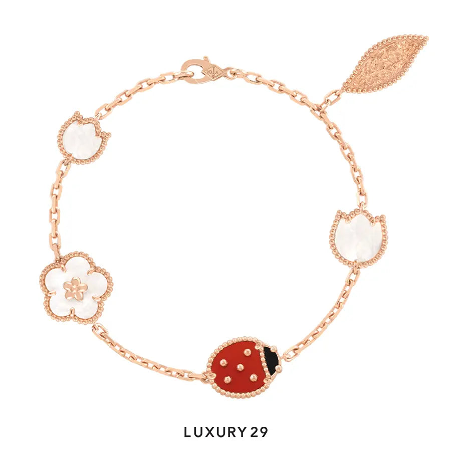 Van Cleef & Arpels Lucky Spring bracelet, 5 motifs 18K rose gold, Carnelian, Mother-of-pearl, Onyx